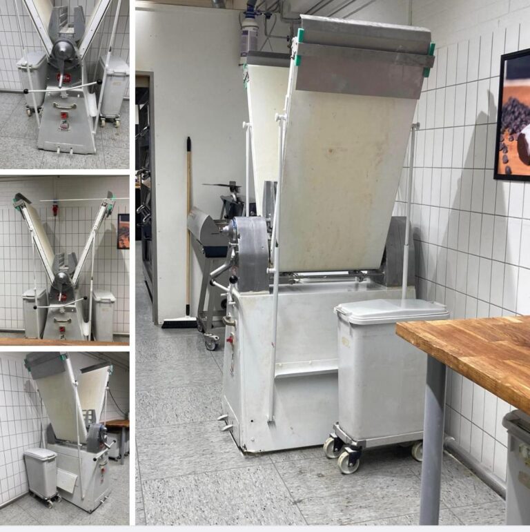 Multipurpose food production machine: This could be a depositor or a divider-rounder used in industrial baking to portion and shape dough.